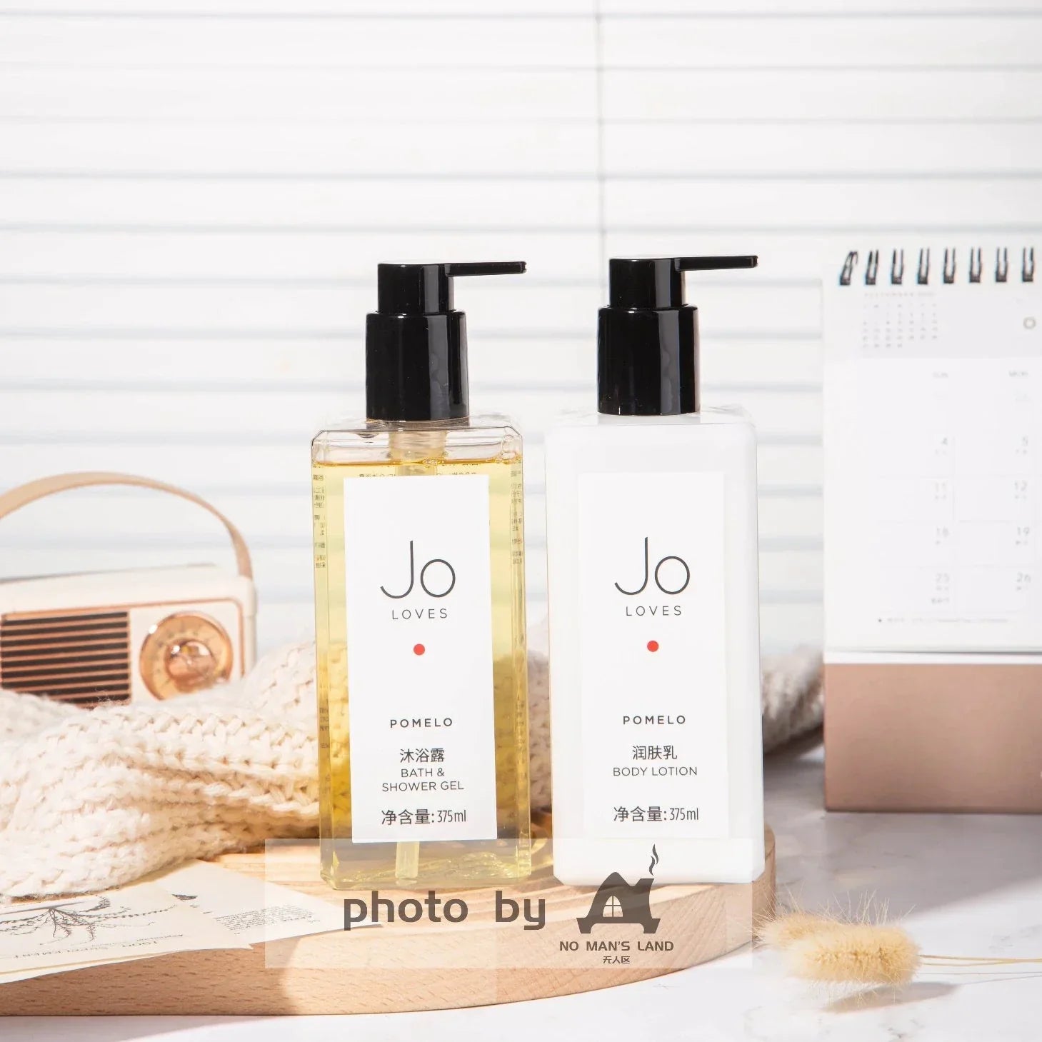 two bottles of JO-LOVES-POMELO-shower-gel-body-lotion